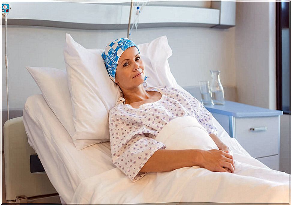 Sick woman in hospital bed.