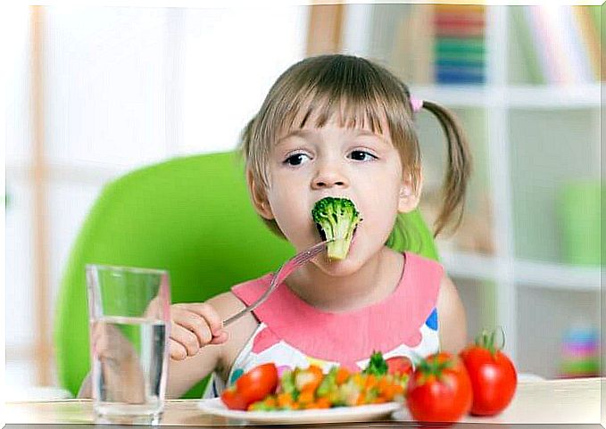 Little girl eating healthy