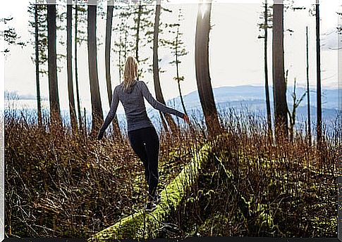 Woman walking through the woods