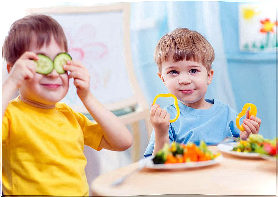 Children playing with vegetables.